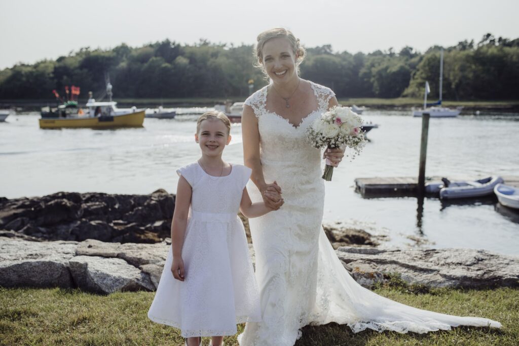 Bride and child by water at nonantum