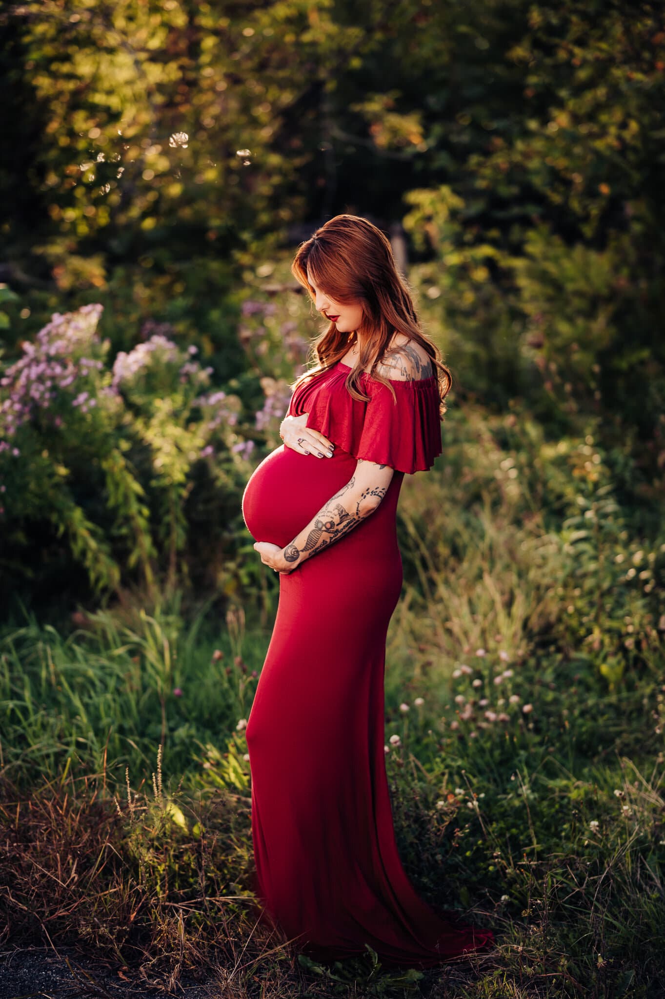 Pregnant Woman wearing red dress maternity photography