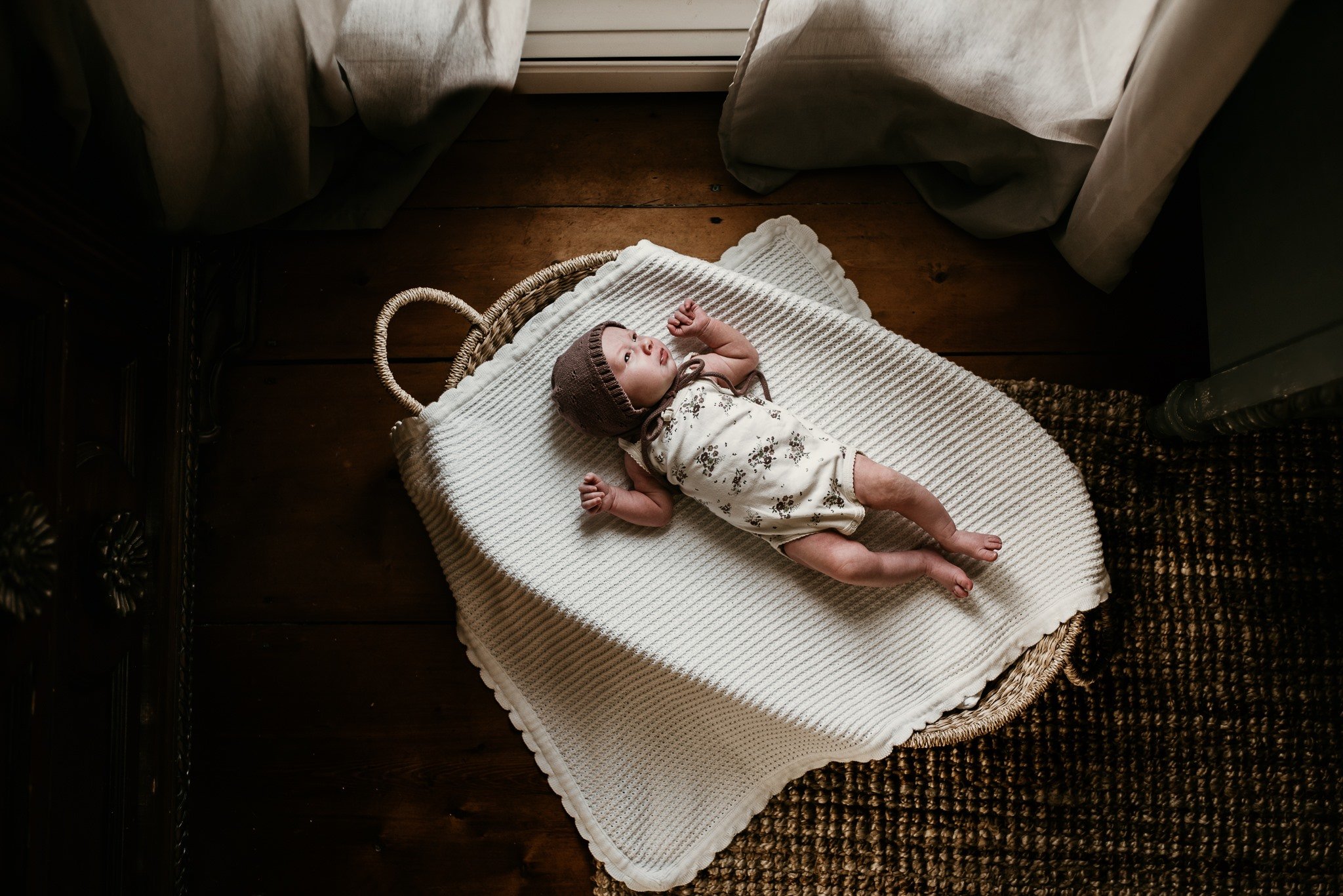 Newborn baby in bassinet 
