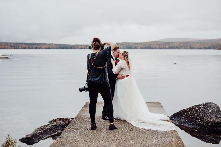 Maine wedding photographer taking photos of couple on lake