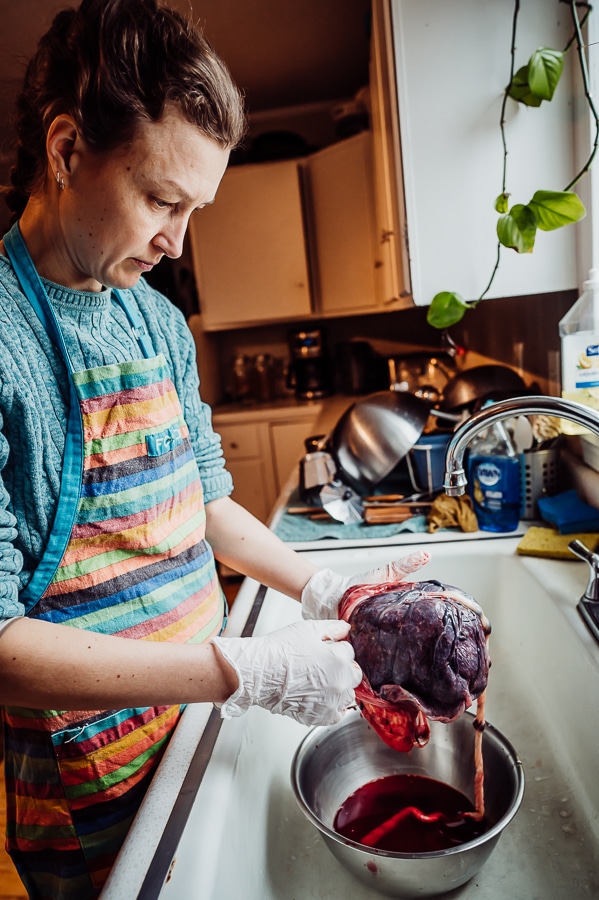 Woman revealing babies side of placenta