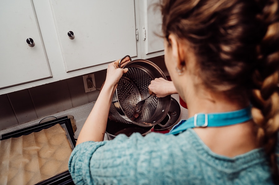 Woman scraping bowl