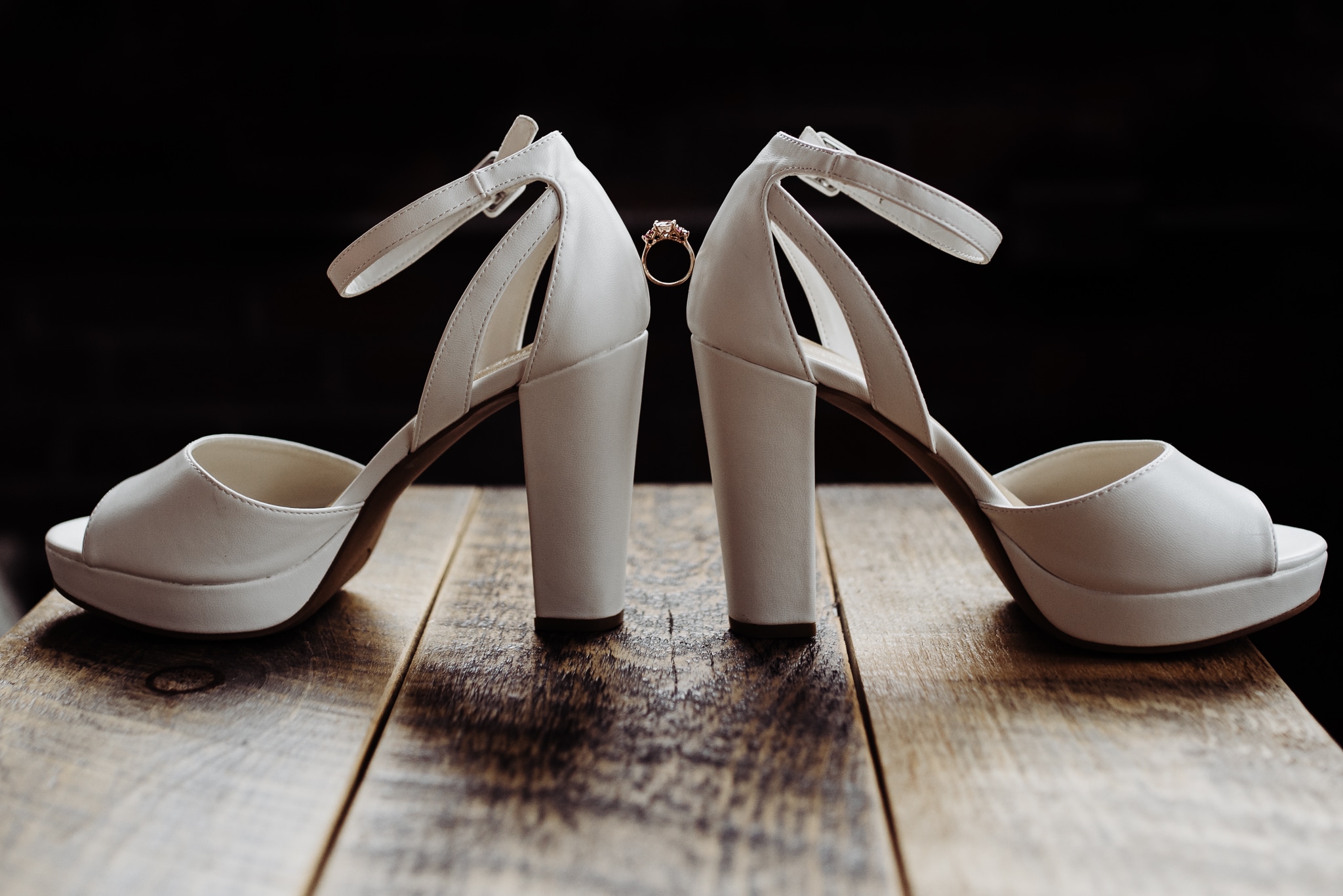 Wedding ring between shoes