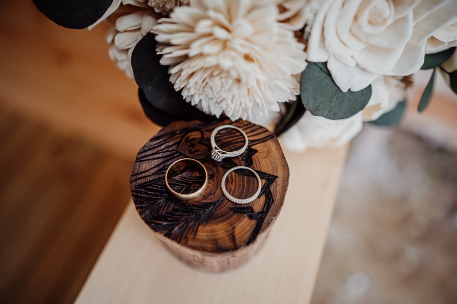Wedding rings sitting on custom wedding box