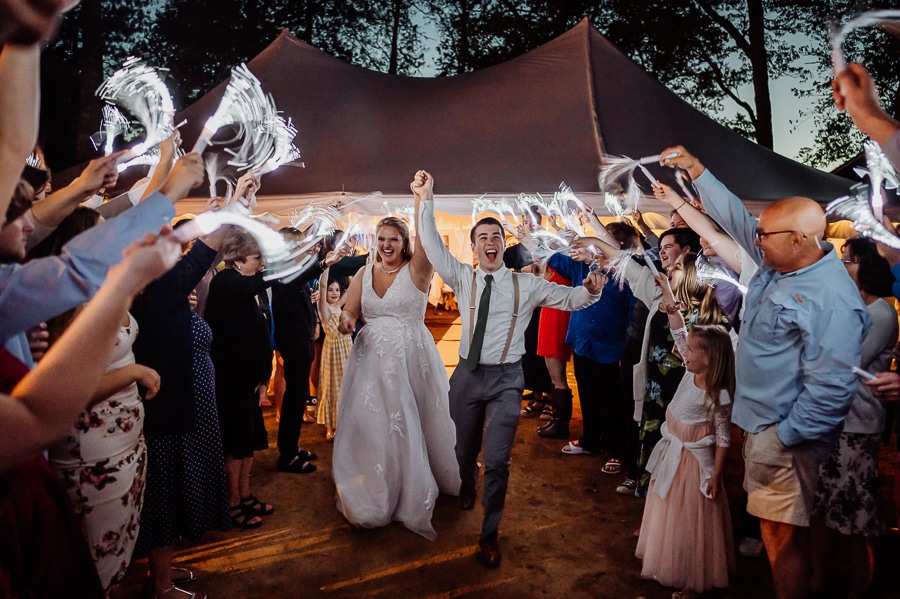 Bride and groom artificial sparkler exit at wedding