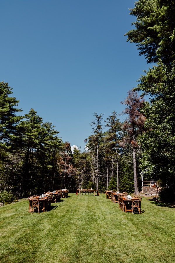 arrangement of tables and chairs at clarks cove farm wedding outdoors