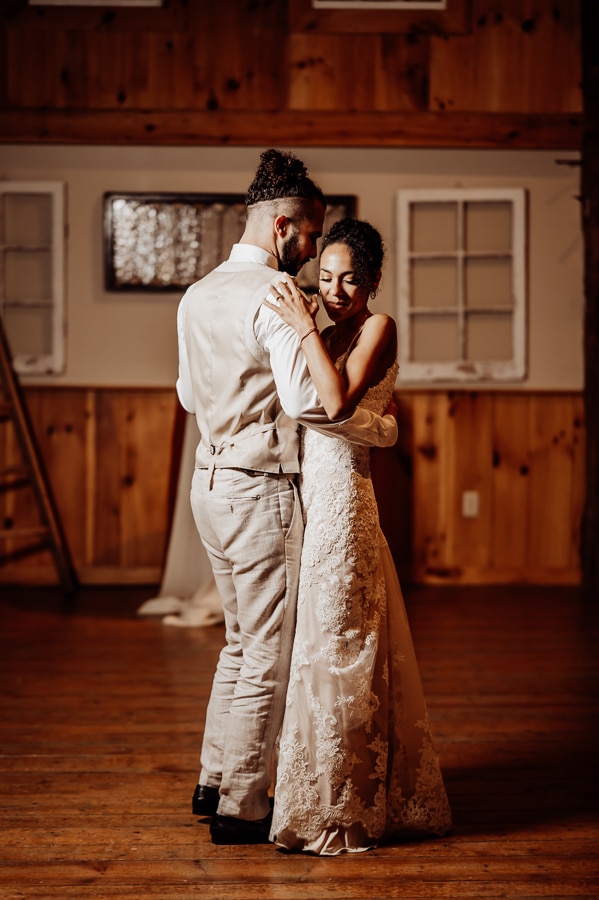 Bride and groom first dance in barn at clarks cove farm inn wedding