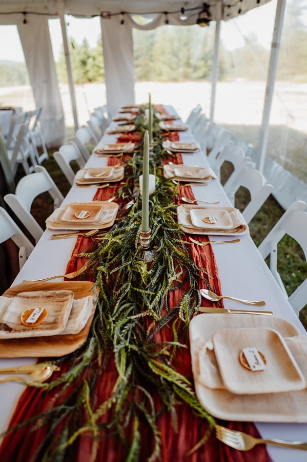 Beautifully decorated tables with florals under tent wedding