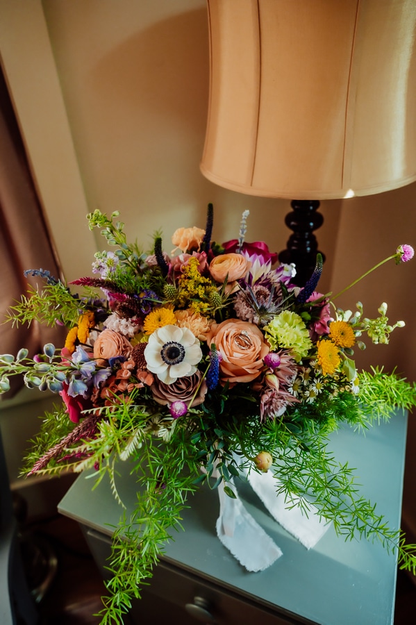Wedding bouquet sitting on side table