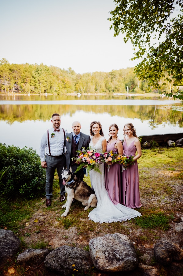 Bridal party with husky in front of millinocket lake at big moose inn