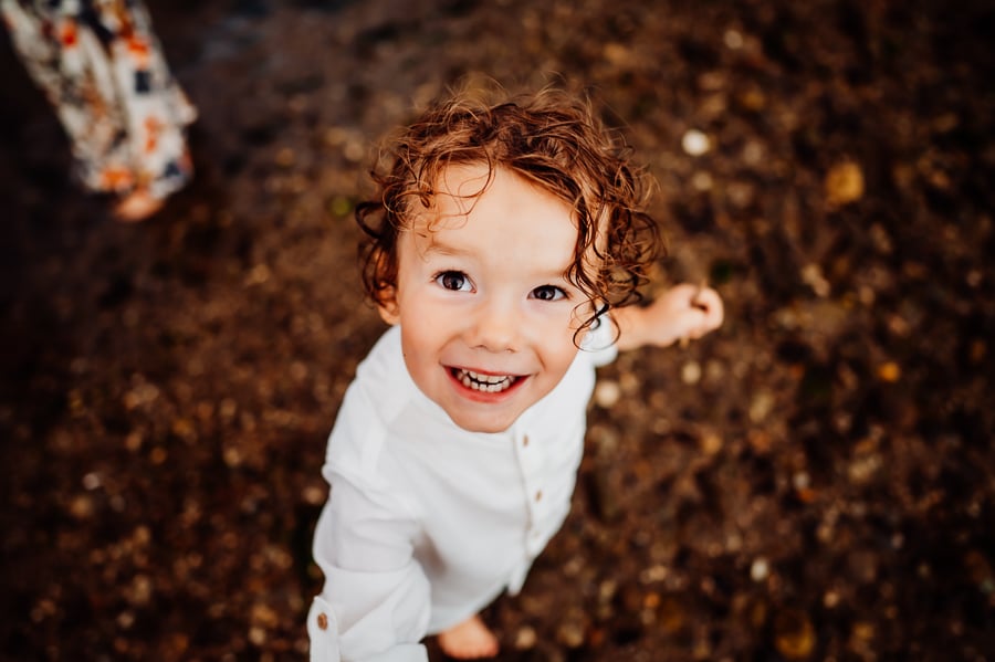 Little boy laughing and smiling wearing white shirt