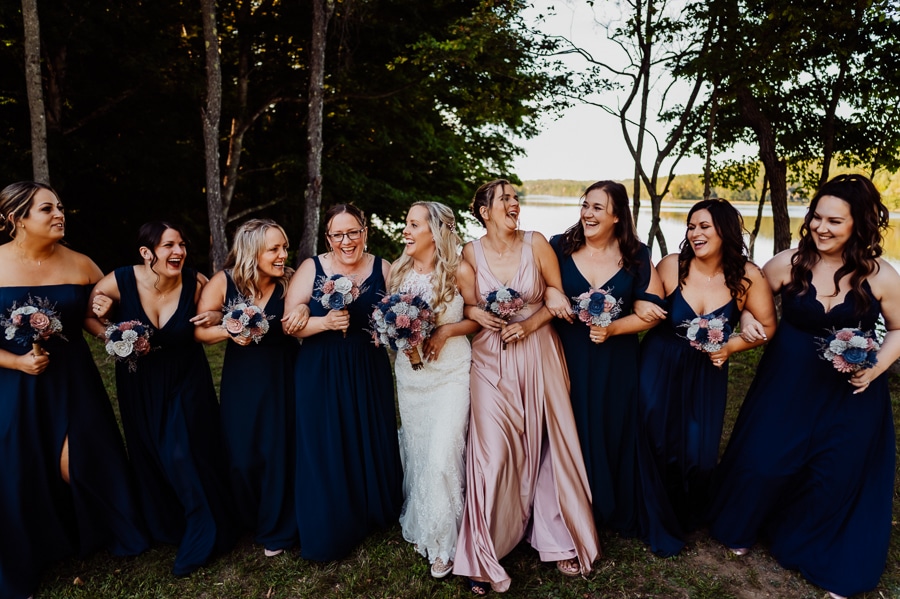 bridesmaids walking together and laughing at each other