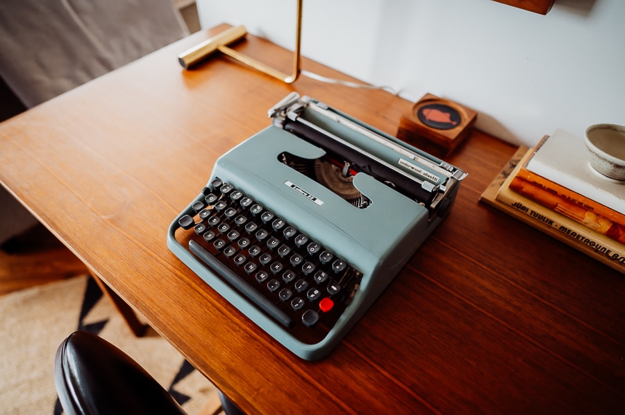 blue typewriter sitting on desk in airbnb