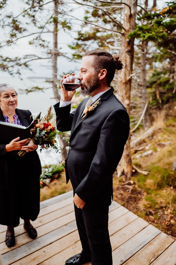 groom drinking wine during elopement ceremony