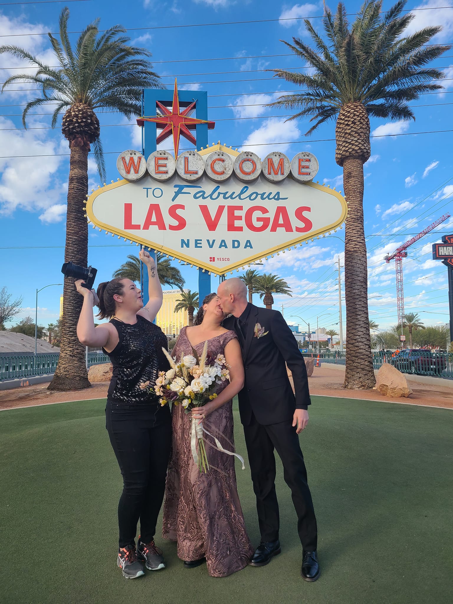 Photographer celebrating with couple getting married in las vegas